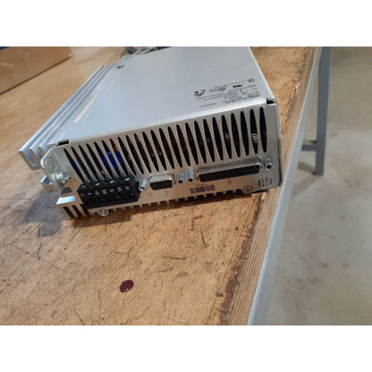 Festo CMMS-AS-C4-3A-G2 Motor Controller. Silver industrial automation equipment on a wooden surface.