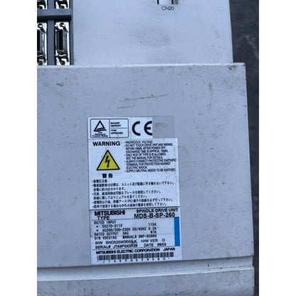 Mitsubishi MDS-B-SP-260 Spindle Drive Unit, industrial automation part, 200-230V, with warning labels, detail view.