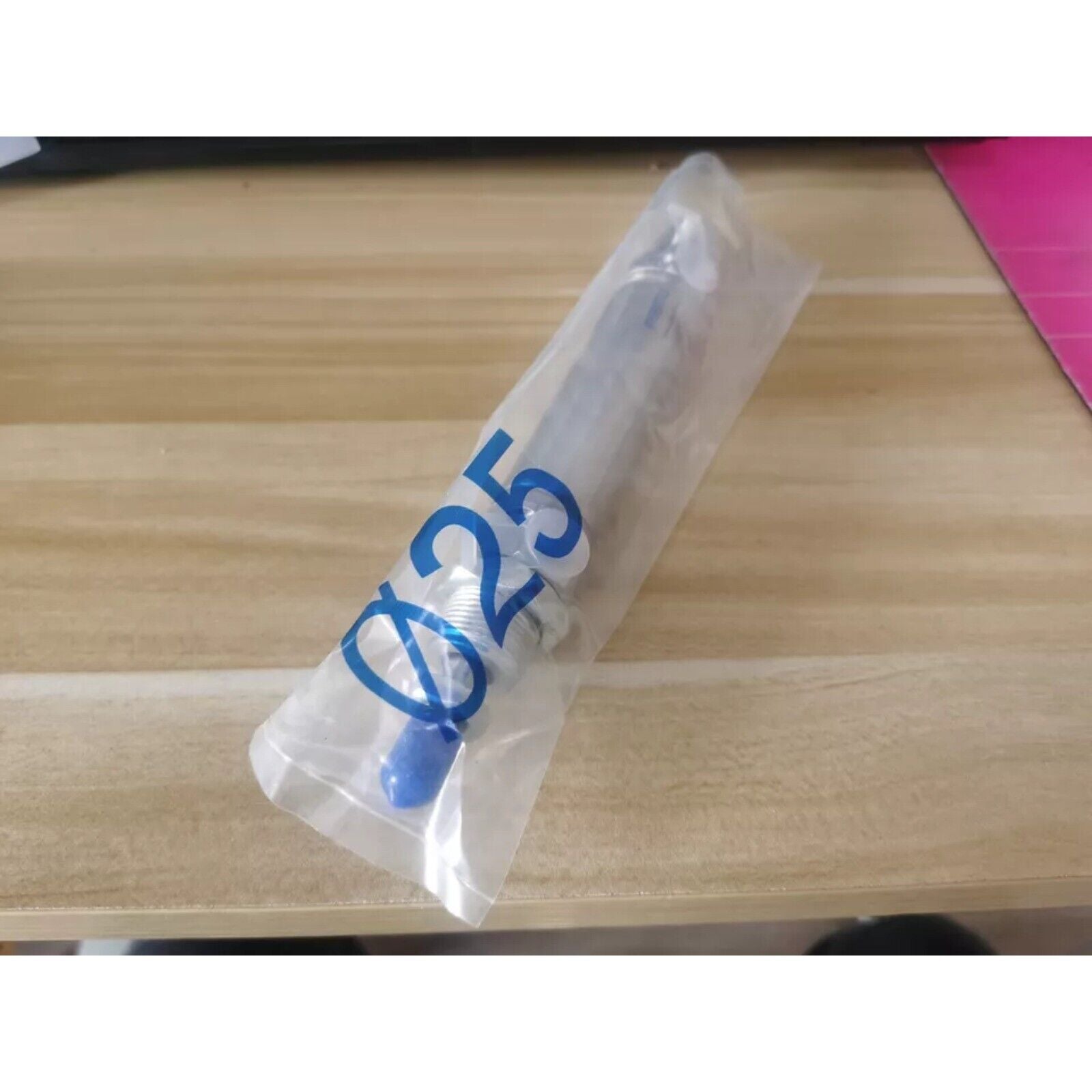Festo DSNU-25-60-PPV-A Cylinder in packaging, with "Ø25" marking, pneumatic component