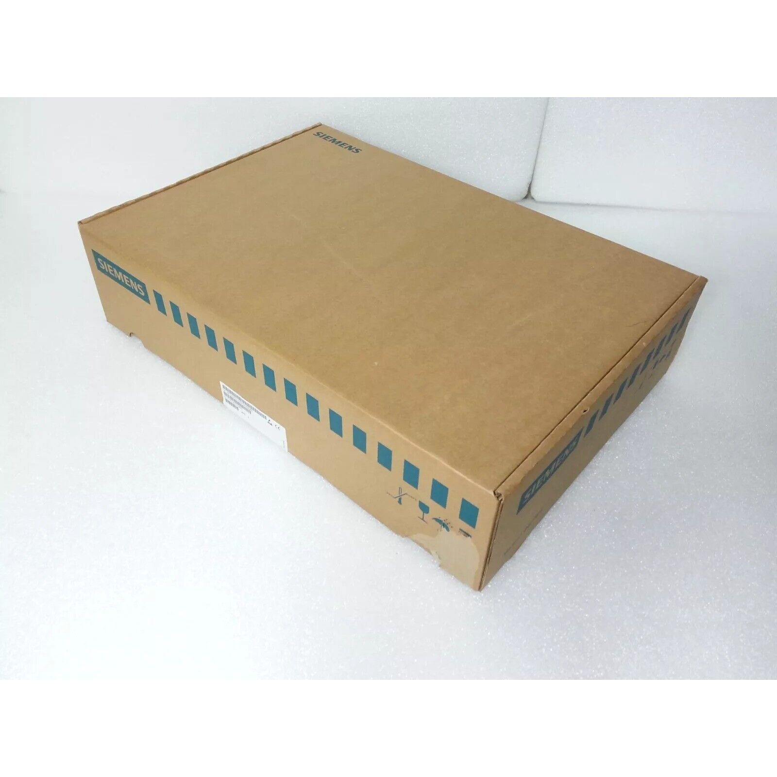 Siemens PLC product packaging box, cardboard box with product information and logo.