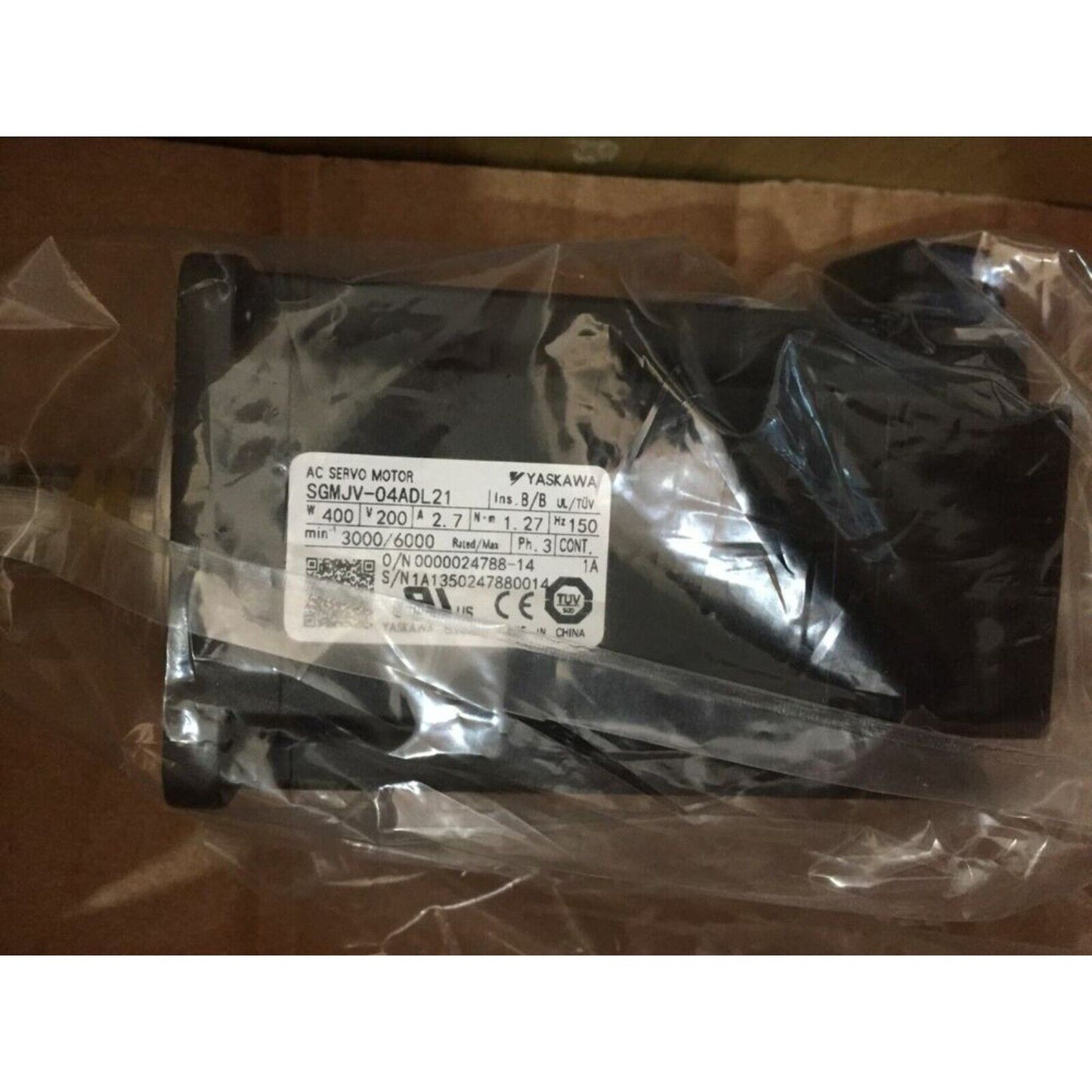 YASKAWA SGMJV-04ADL21 AC Servo Motor in packaging. Industrial automation part with specifications.