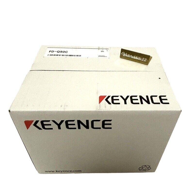 Keyence FD-Q50C Clamp-On Flow Sensor in its original packaging, with the Keyence logo prominently displayed.