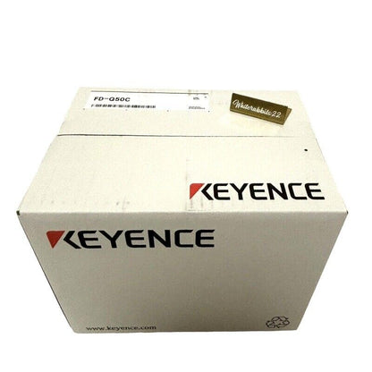 Keyence FD-Q50C Clamp-On Flow Sensor in its original packaging, with the Keyence logo prominently displayed.