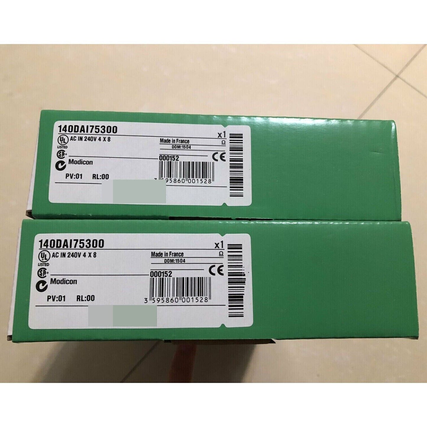 Schneider Electric 140DAI75300 Discrete Input Module, PLC Module, Made in France, with product details visible.