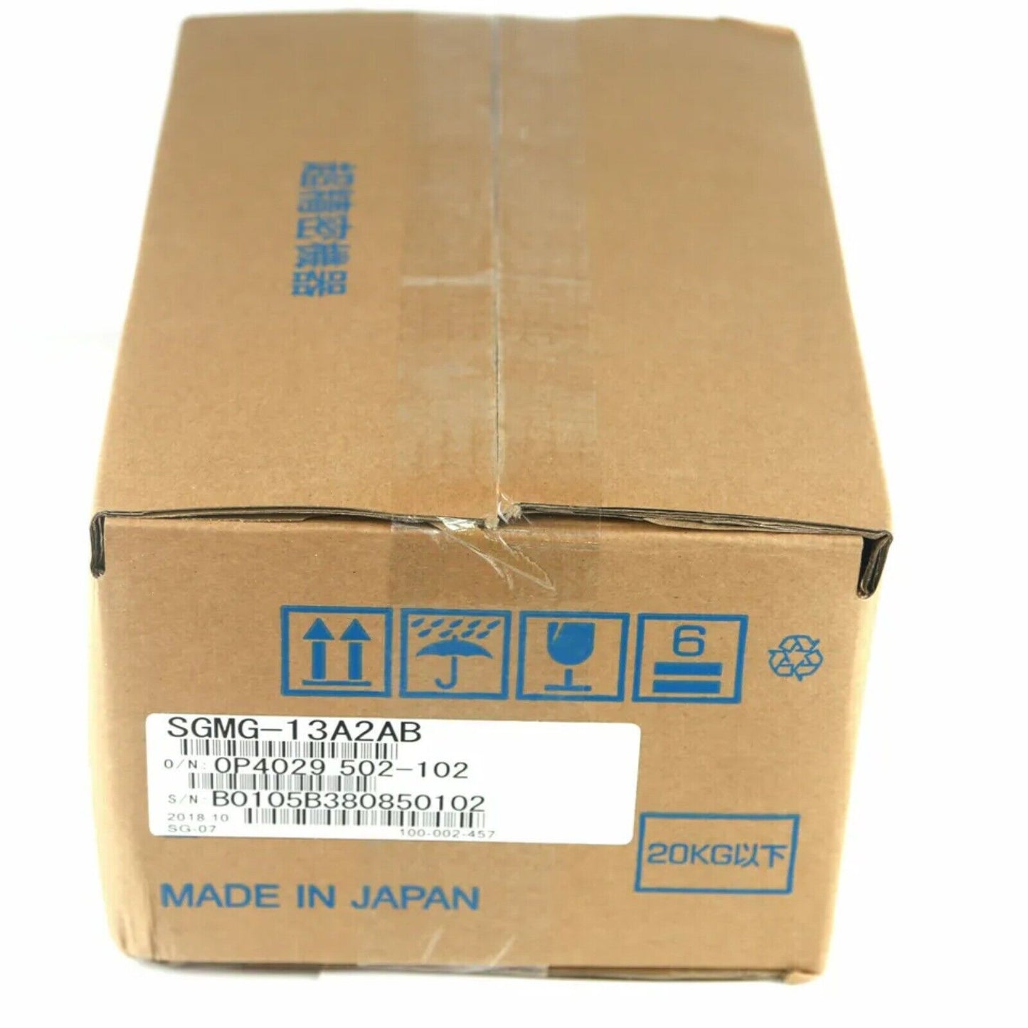 YASKAWA SGMG-13A2AB servo motor in box, Made in Japan. Shipping label with product details.