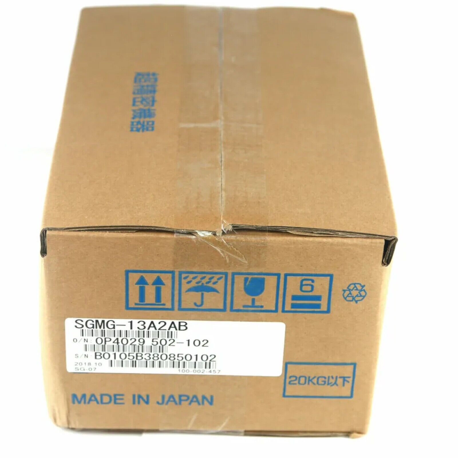 YASKAWA SGMG-13A2AB servo motor in box, Made in Japan. Shipping label with product details.