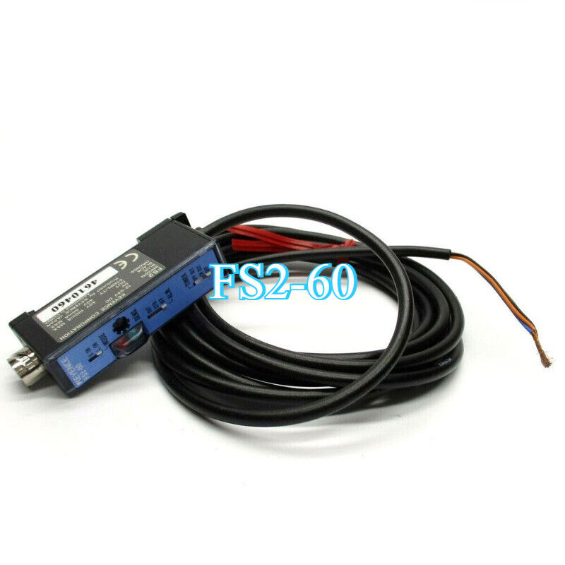Keyence FS2-60 Fiber Optic Amplifier Sensor. Black sensor with FS2-60 label and black cable for industrial automation.