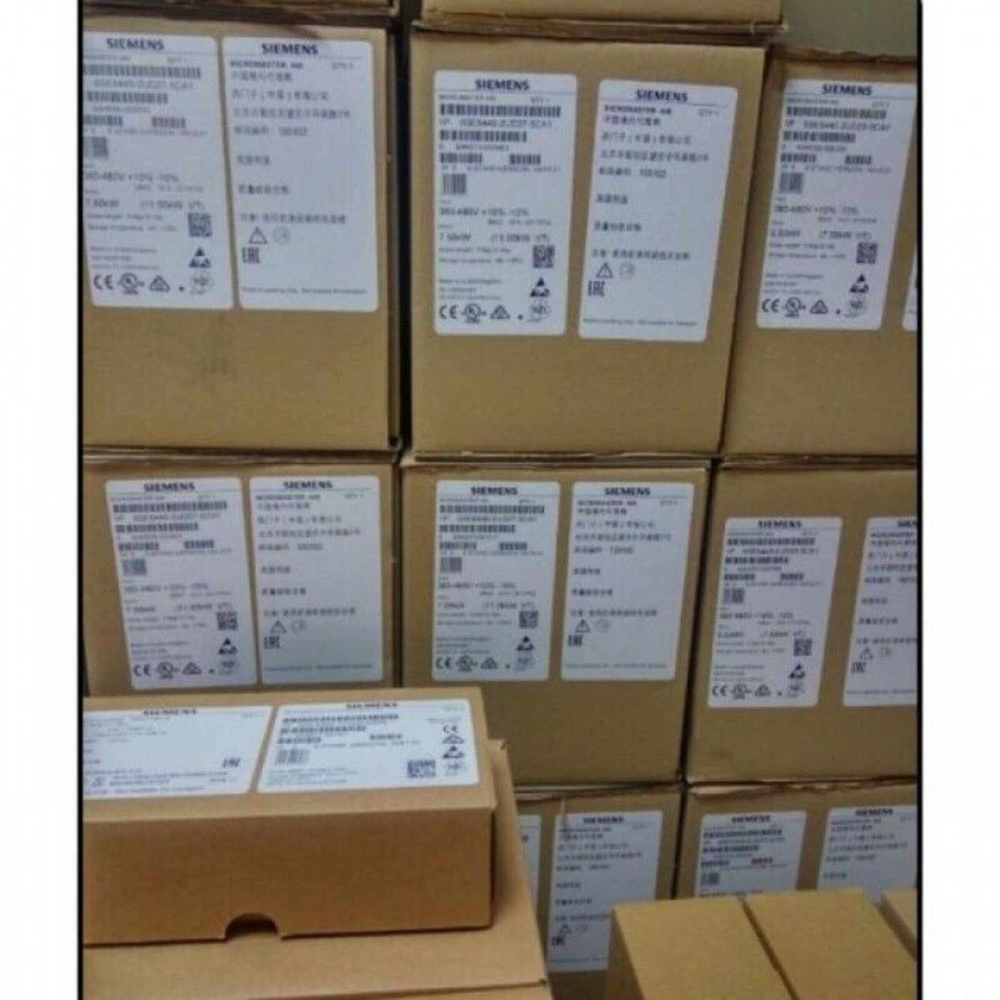 Siemens SINAMICS G120 Power Modules in cardboard boxes, industrial automation parts, warehouse storage.