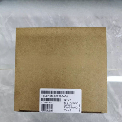 Siemens SIMATIC S7-300 PLC CPU 314C-2DP in brown cardboard box, product details visible.