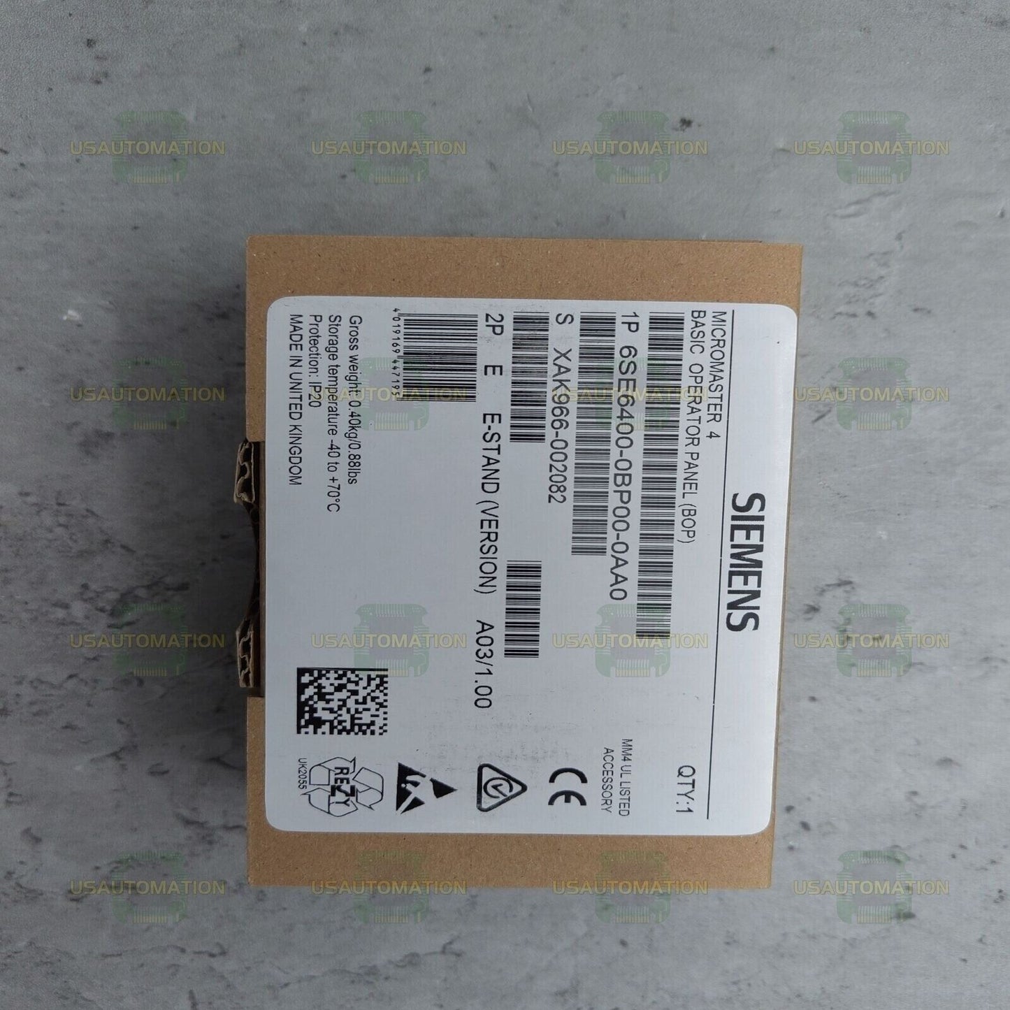 Siemens MICROMASTER 4 Basic Operator Panel (BOP) 6SE6400-0BP00-0AA0 on brown cardboard box, industrial automation part.