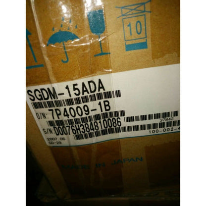 Yaskawa SGDM-15ADA servo drive box label, Made in Japan, with part number and serial number details.