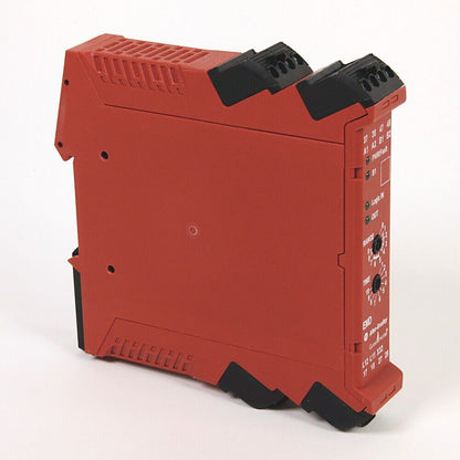 Allen-Bradley 440R-EM4R2D Guardmaster Safety Relay in red, with black components, showing inputs, outputs and time settings