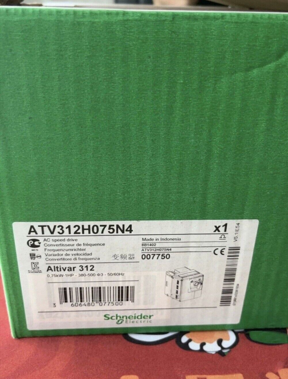 Schneider Electric ATV312H075N4 variable speed drive box, with product label displaying model, specs, and brand.
