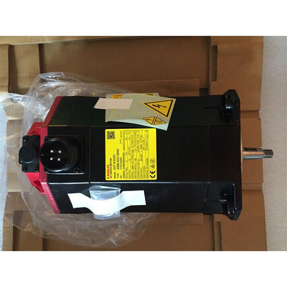 FANUC A06B-0227-B000 Servo Motor, new in box, black and red industrial automation part.