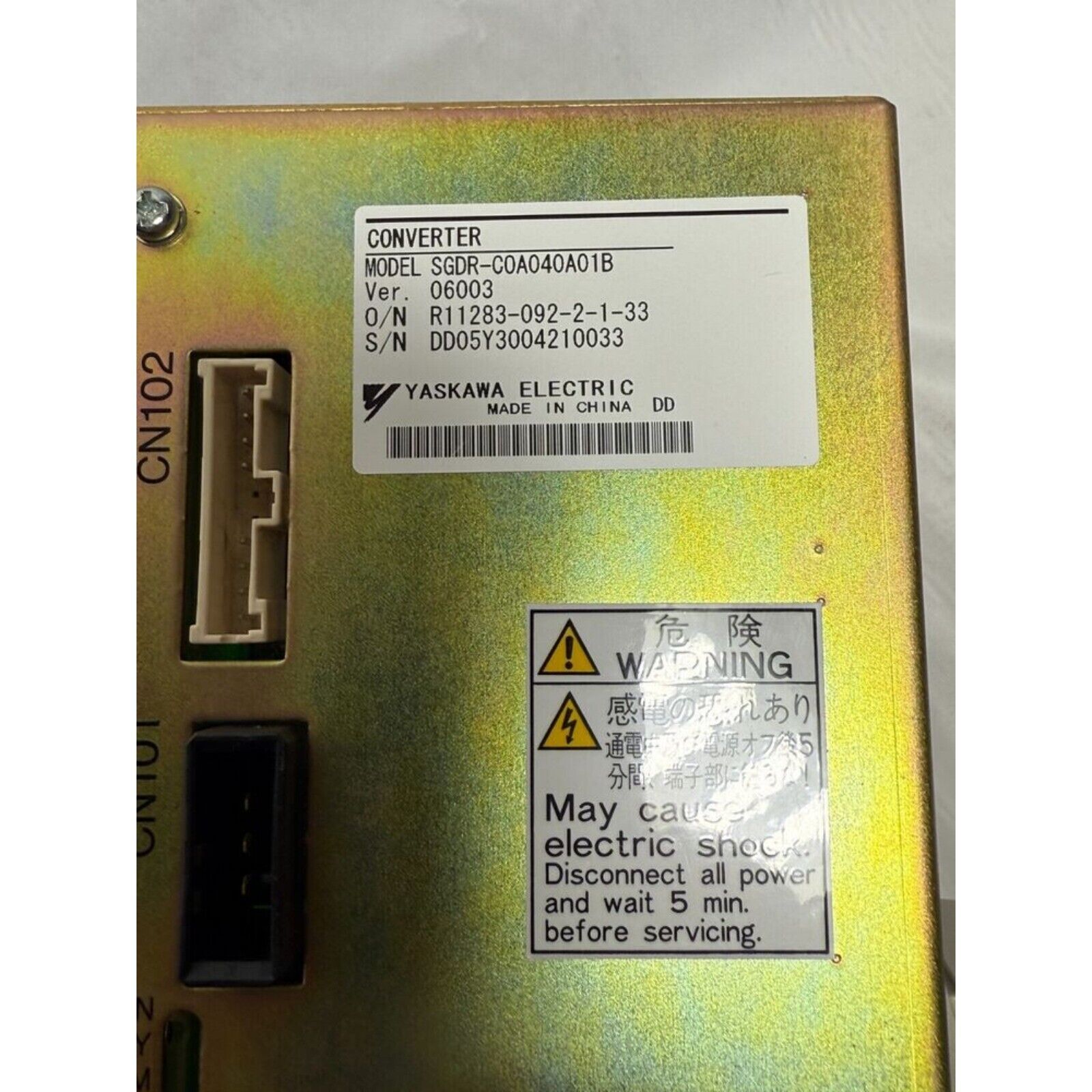 YASKAWA SGDR-C0A040A01B servo drive converter, warning label, metallic finish. Industrial automation part.