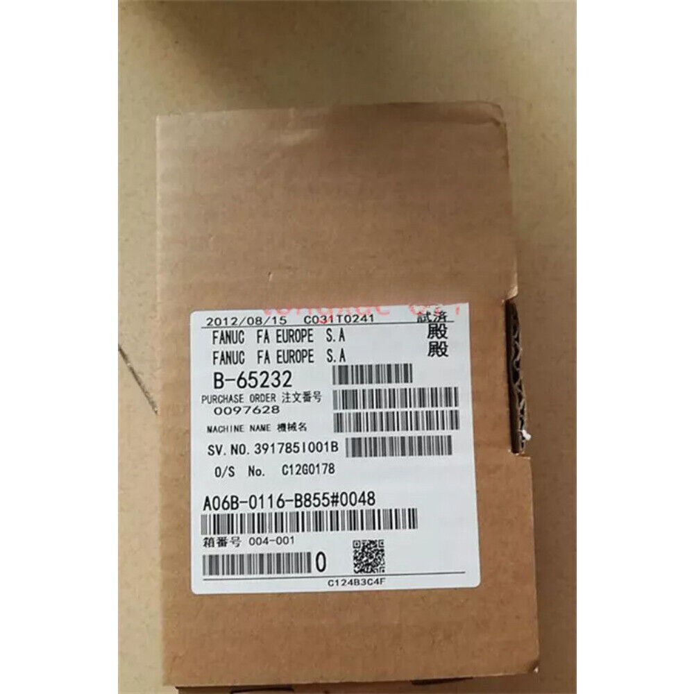 FANUC A06B-0116-B855#0048 Servo Motor with label showing part number, brand details, and purchase order information.