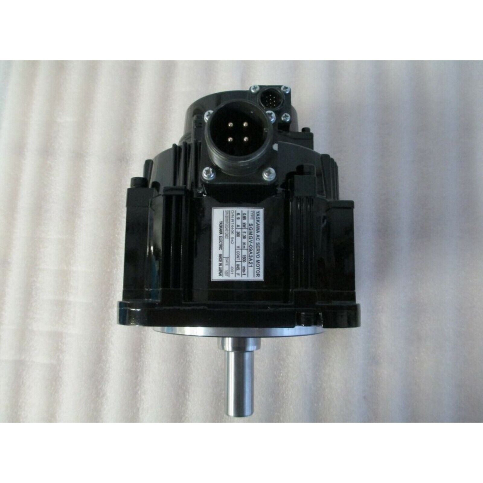 YASKAWA SGMGV-09A3A21 AC Servo Motor, black industrial equipment, front view, MADE IN JAPAN.