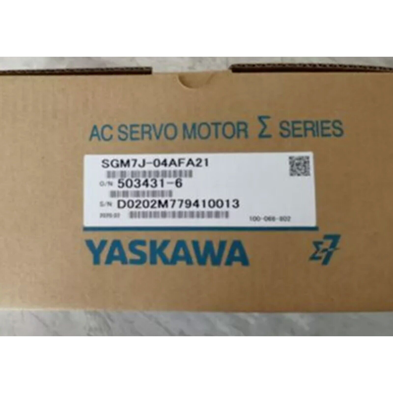 YASKAWA SGM7J-04AFA21 AC Servo Motor box. Industrial automation part with model, serial details.