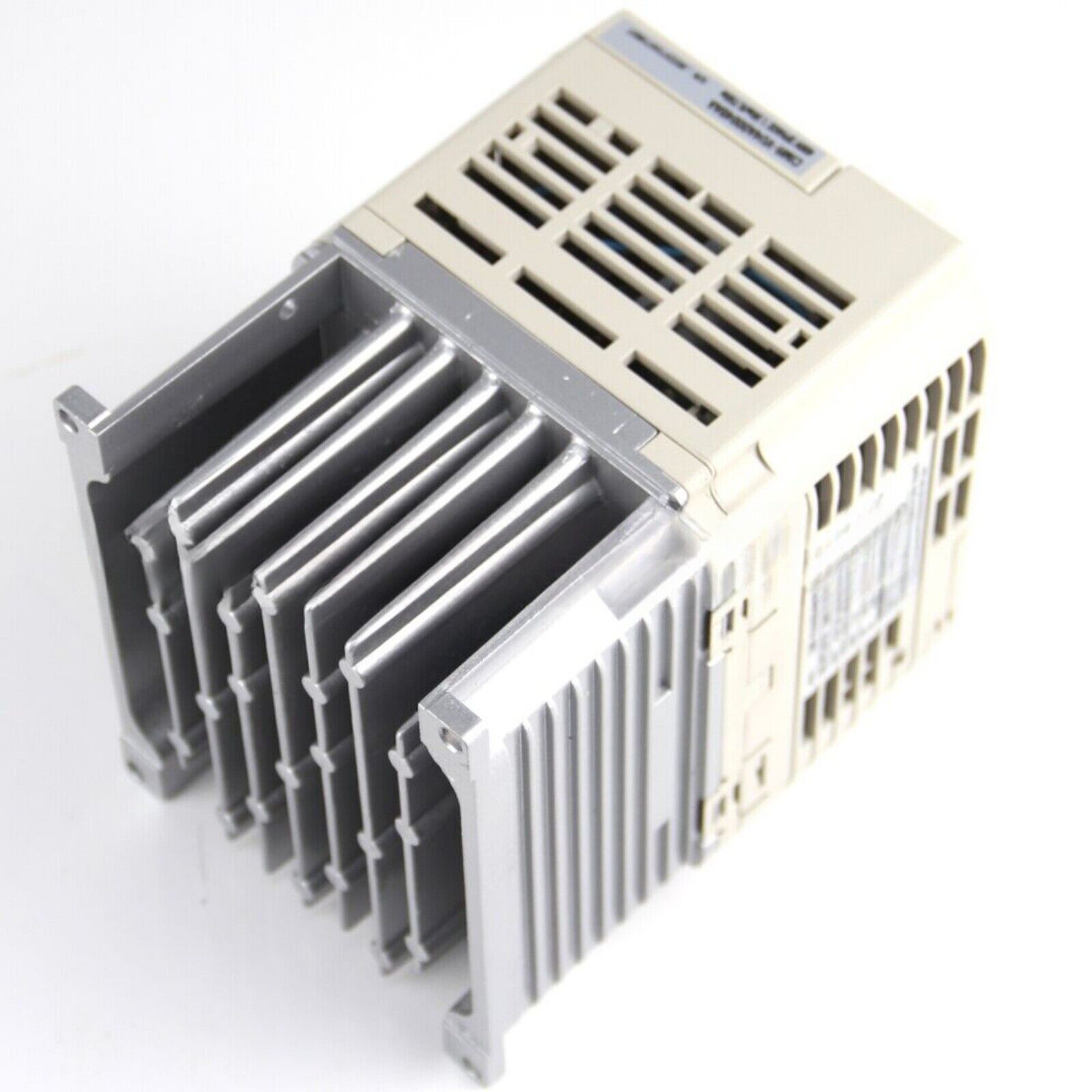Yaskawa CIMR-VU4A0004BAA Variable Frequency Drive, beige casing, silver heat sink fins, industrial automation equipment.