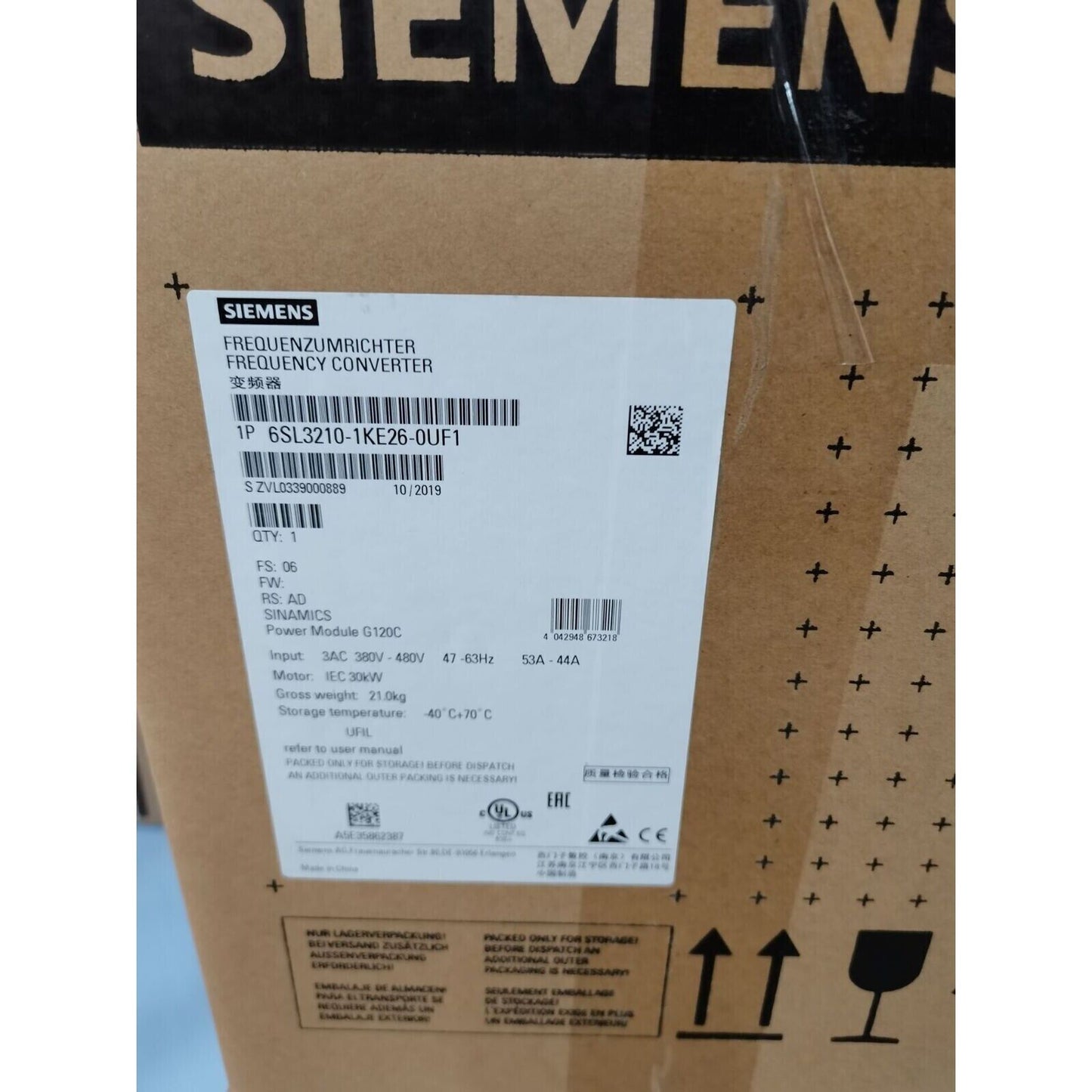 Siemens SINAMICS G120 Power Module 6SL3210-1KE26-0UF1 on shipping box, 30kW frequency converter, industrial drive