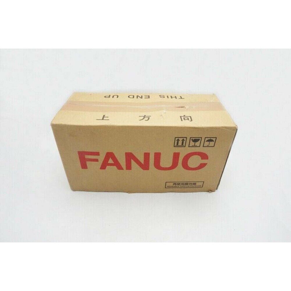 FANUC A06B-0075-B003 Servo Motor box. Brown cardboard box with FANUC logo and Chinese text indicating top direction.