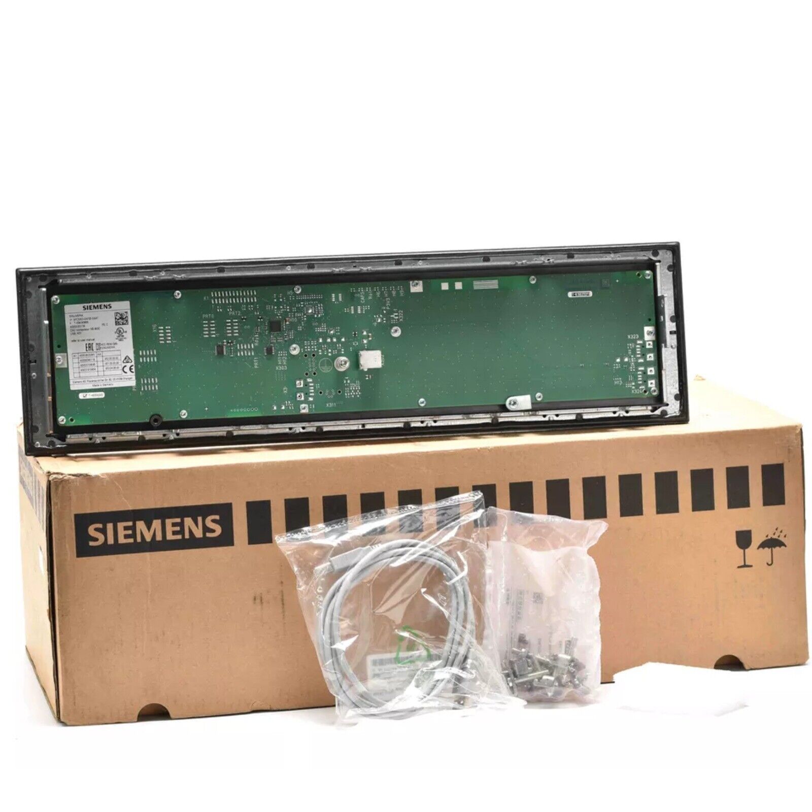 Siemens SINAMICS S120/SINUMERIK CNC system component, with a green circuit board and black frame, inside a SIEMENS box.