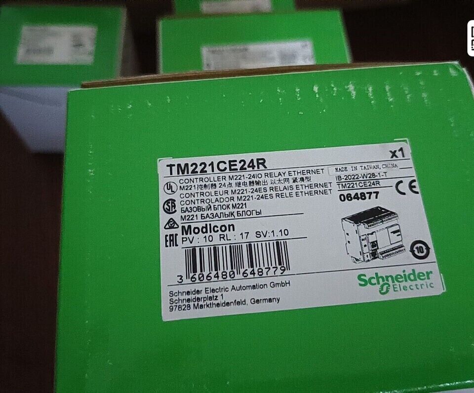 Schneider Electric Modicon M221 TM221CE24R PLC controller box, compact design with Ethernet for automation.