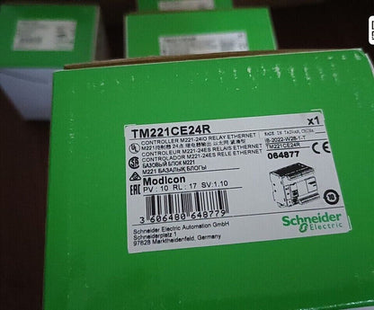 Schneider Electric Modicon M221 TM221CE24R PLC controller box, compact design with Ethernet for automation.