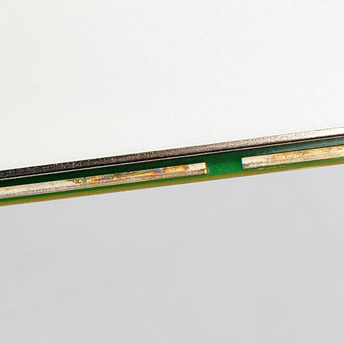 National Instruments PXI-4071 multimeter component detail. Green board with metallic elements for data acquisition.