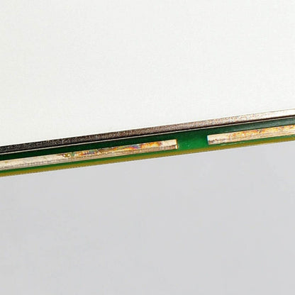 National Instruments PXI-4071 multimeter component detail. Green board with metallic elements for data acquisition.