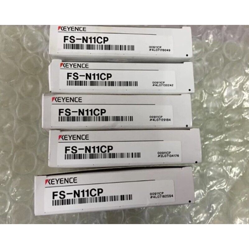 Keyence FS-N11CP Fiber Optic Sensors in boxes. Industrial automation parts.