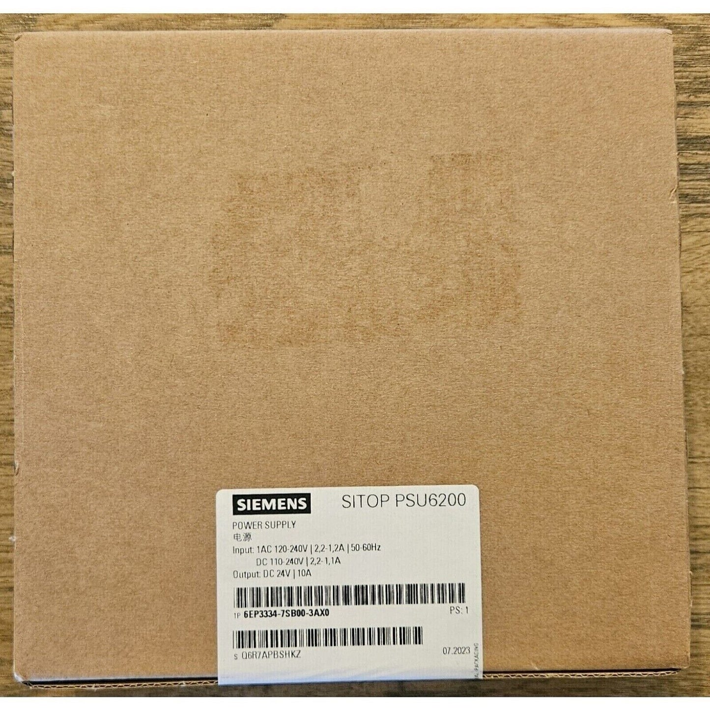 Siemens SITOP PSU6200 power supply unit in brown cardboard box. Industrial automation component, model 6EP3334-7SB00-3AX0.