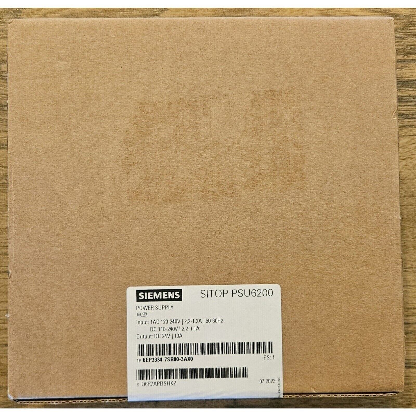 Siemens SITOP PSU6200 power supply unit in brown cardboard box. Industrial automation component, model 6EP3334-7SB00-3AX0.