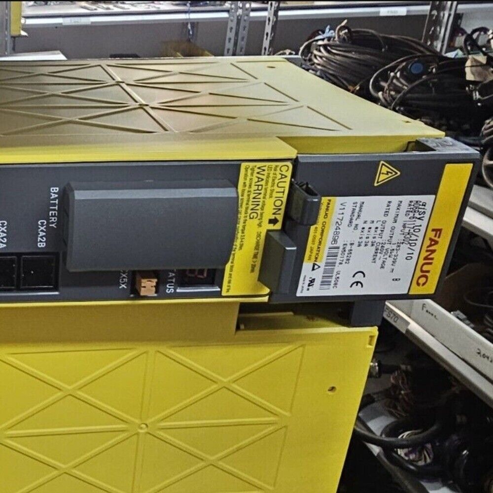 FANUC Servo Amplifier A06B-6117-H302 FS15, yellow housing, black panel with warnings and specifications.