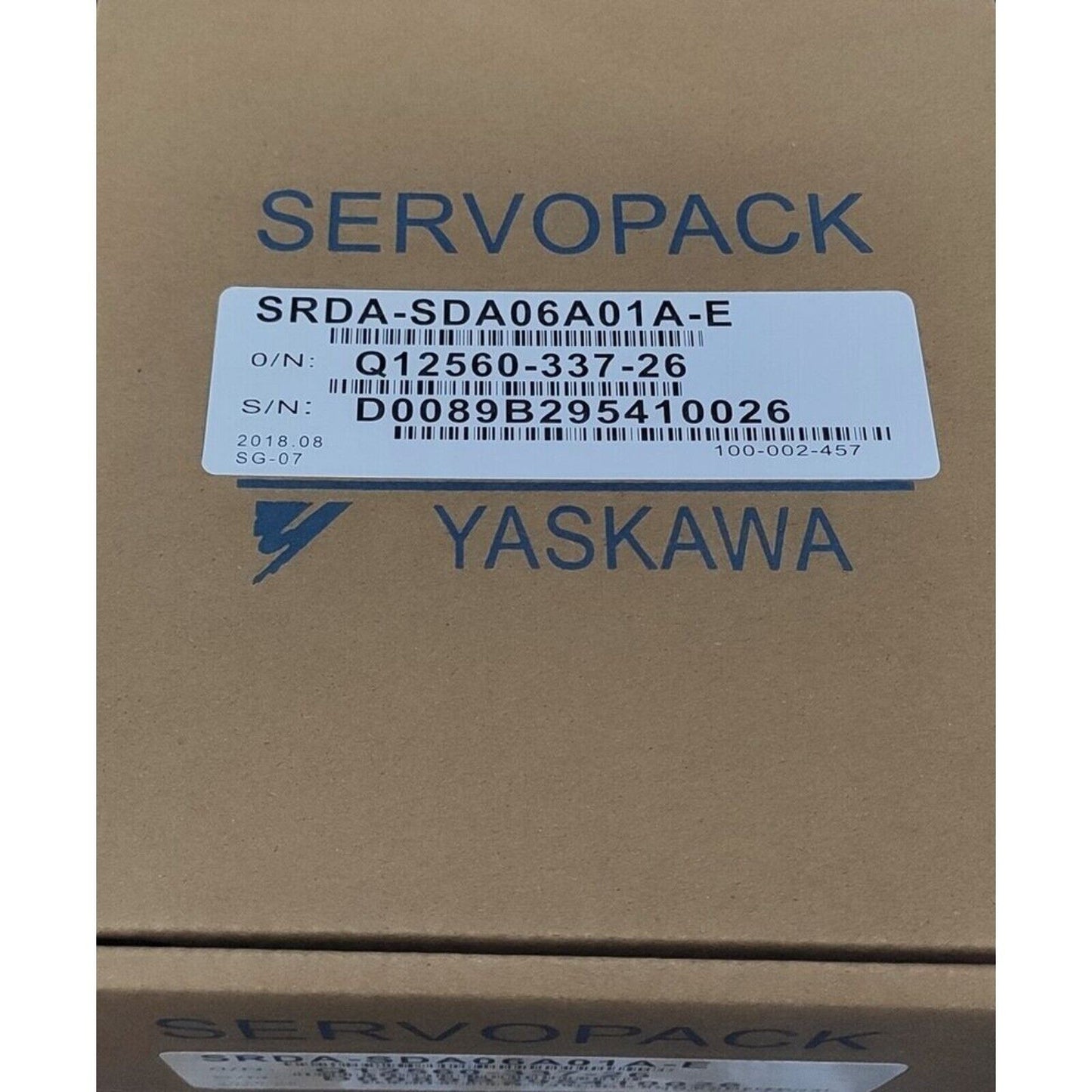 YASKAWA SRDA-SDA06A01A-E Servo Motor on a cardboard box, product label visible.