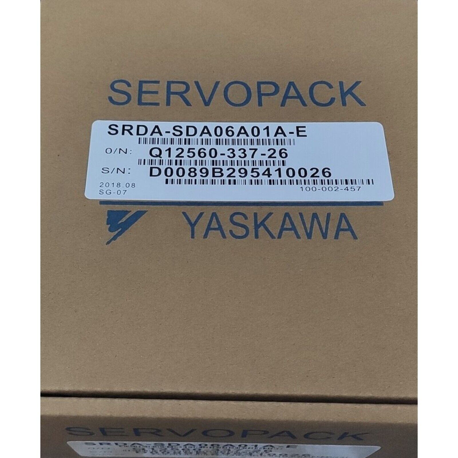 YASKAWA SRDA-SDA06A01A-E Servo Motor on a cardboard box, product label visible.