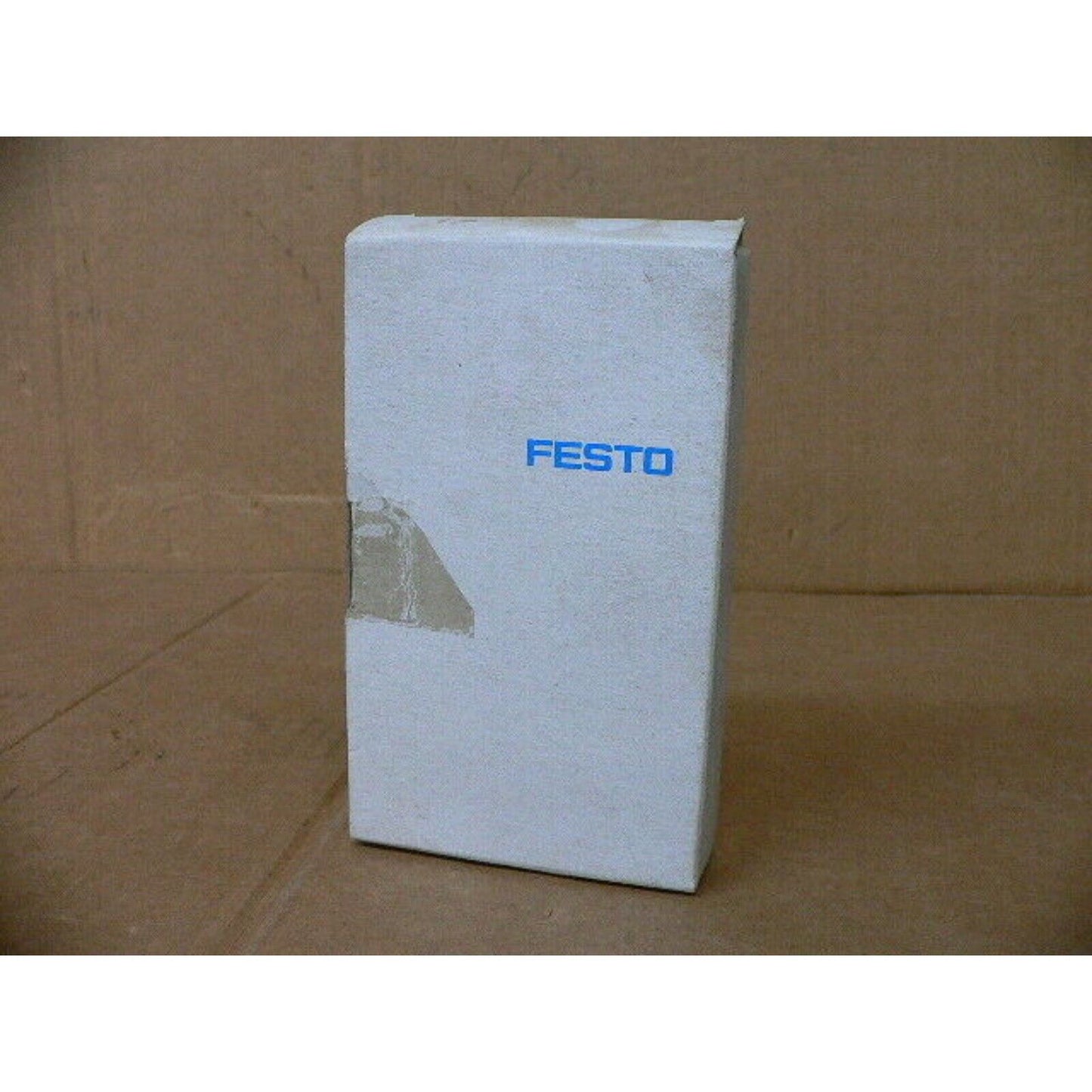 FESTO branded product packaging. Industrial automation parts.