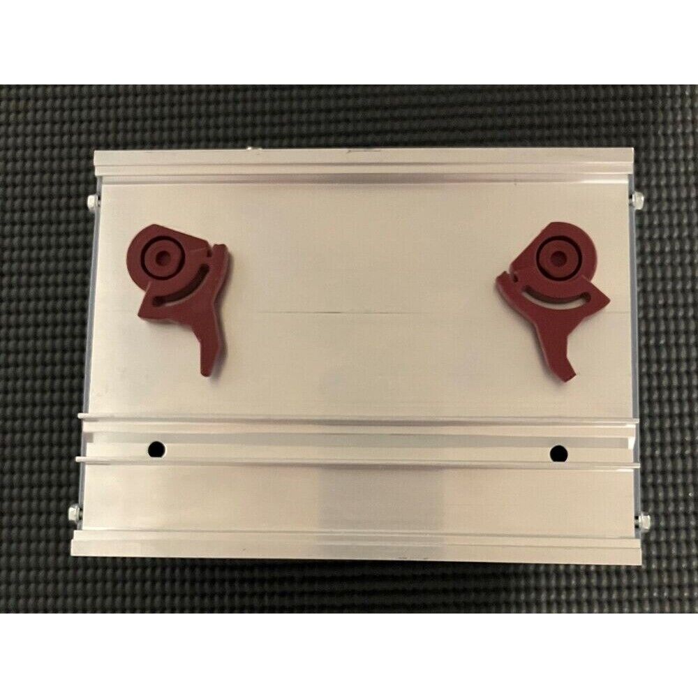 B&R automation module, gray metal case with two red components, industrial automation equipment.