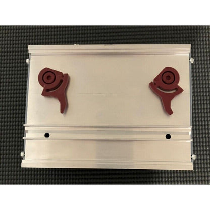 B&R automation module, gray metal case with two red components, industrial automation equipment.