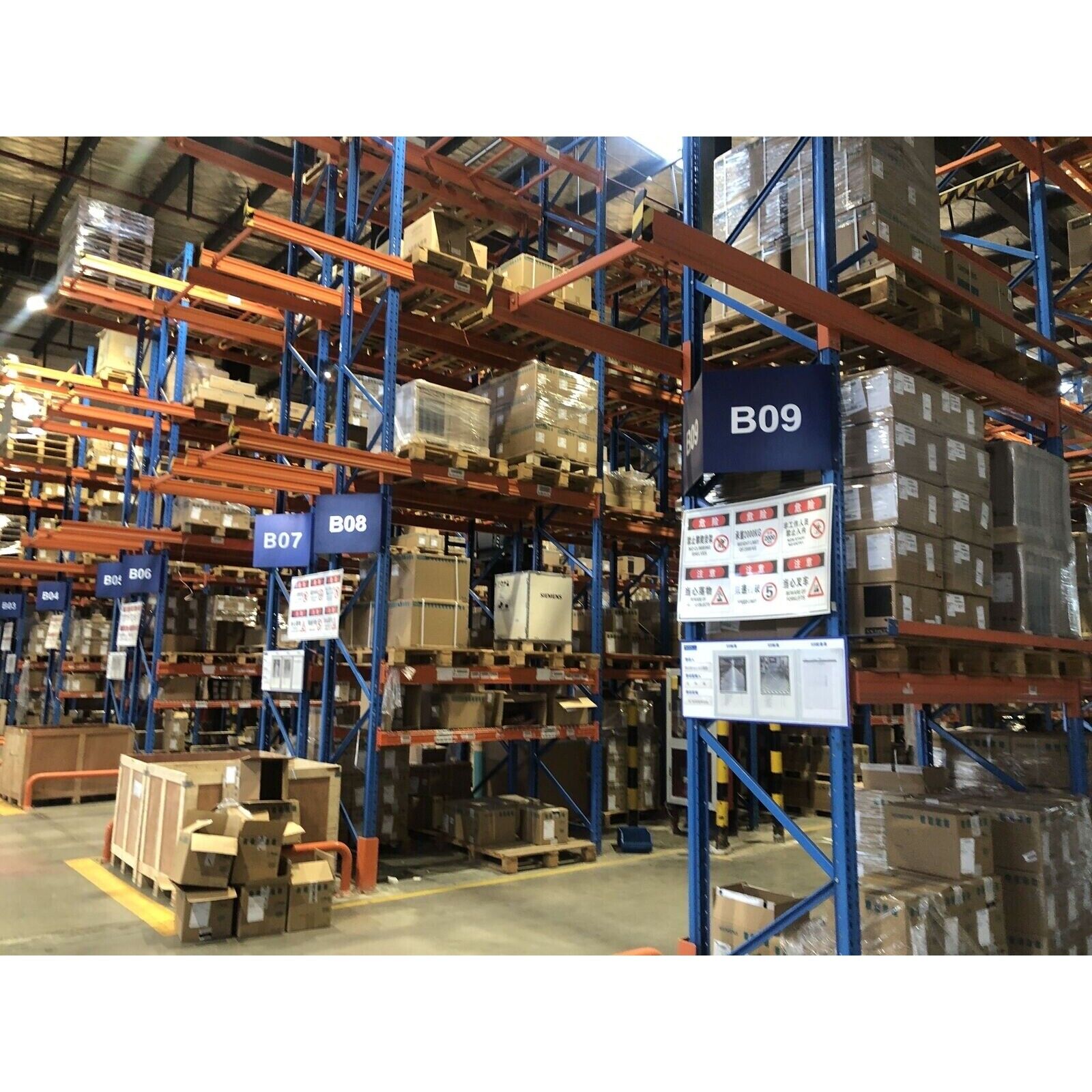 Warehouse with industrial automation parts, Siemens products on shelves, B09, B08, B07, B06 labels.