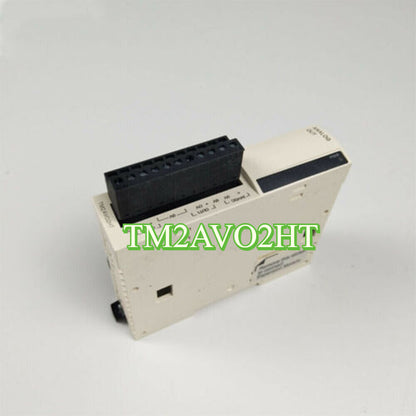 Schneider TM2AVO2HT Output Analog Expansion Module, PLC component, cream-colored housing, black connector.