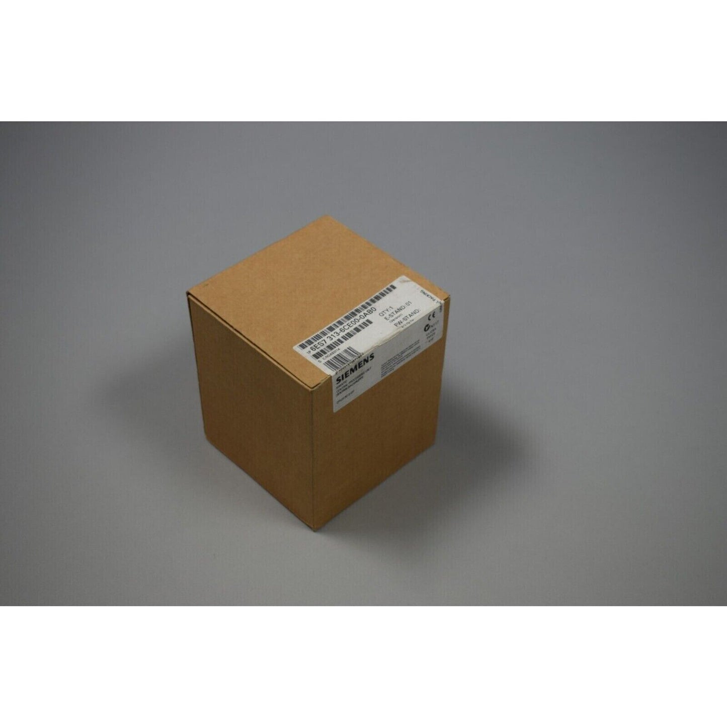 Siemens SIMATIC S7-300 PLC module in a brown box, model 6ES7 313-6CE00-0AB0