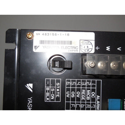 Yaskawa servopack CACR-SR05BC1ES-Y278 servo drive detail. Features a power switch labeled 'ON', various ports, and labels.