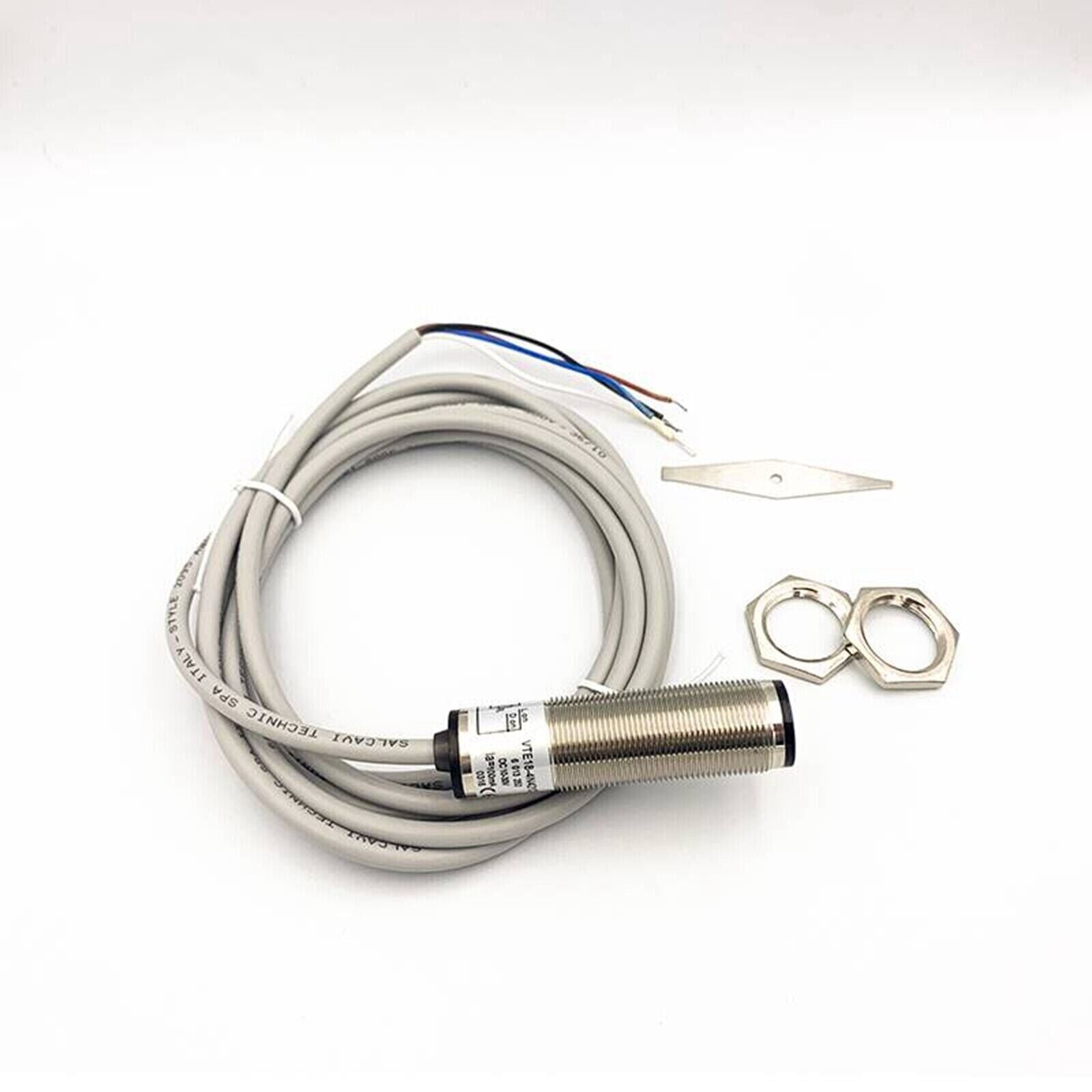 SICK VTE18-4N4212 photoelectric sensor with grey cable, accessories, and mounting hardware. Industrial automation part.