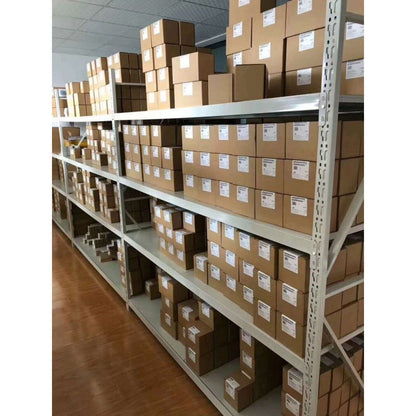 Warehouse shelves stocked with Siemens automation components, in boxes. Industrial parts in stock.