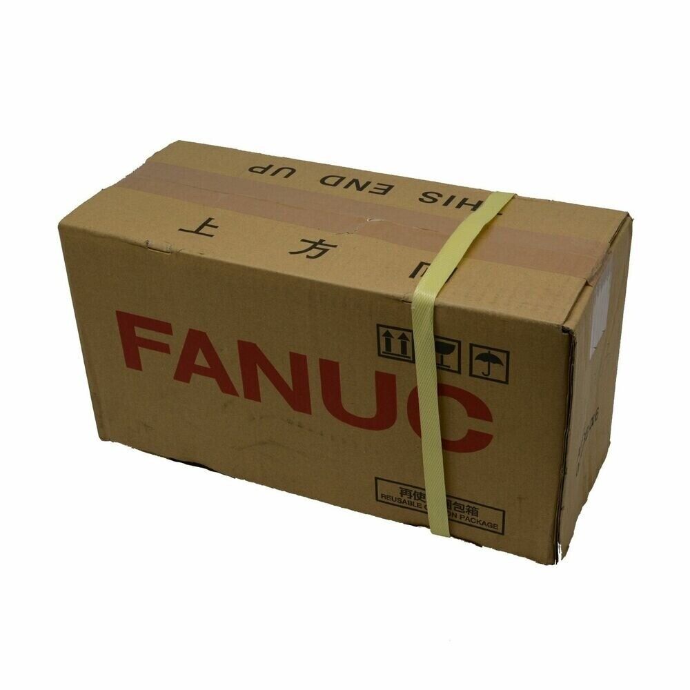 FANUC Servo Motor Packaging Box - Brown cardboard box with yellow strap, and FANUC logo,  'THIS END UP' direction label.