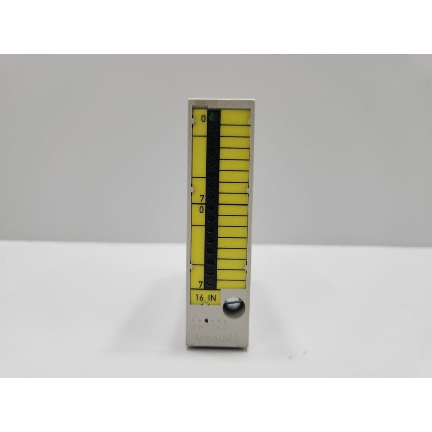Siemens PLC module 6FC5111-0CA01-0AA0. Beige casing with yellow indicators. 16 IN marking. CNC DMP component.