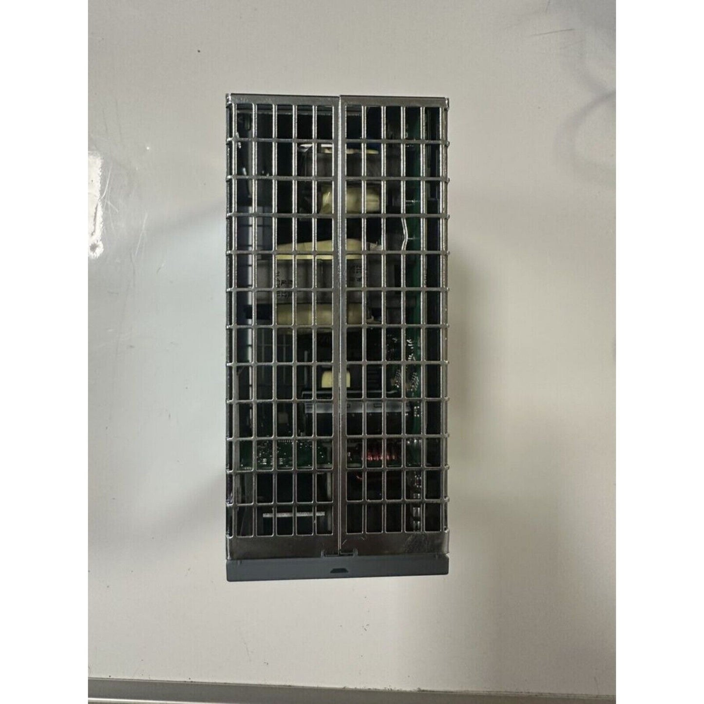 Siemens SITOP Power Supply 6EP3336-7SB00-3AX0, industrial automation component in a metal cage.