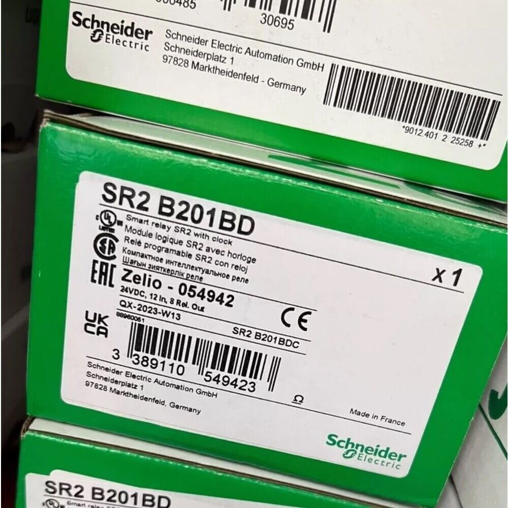 Schneider SR2 B201BD smart relay module in its packaging, industrial automation component.