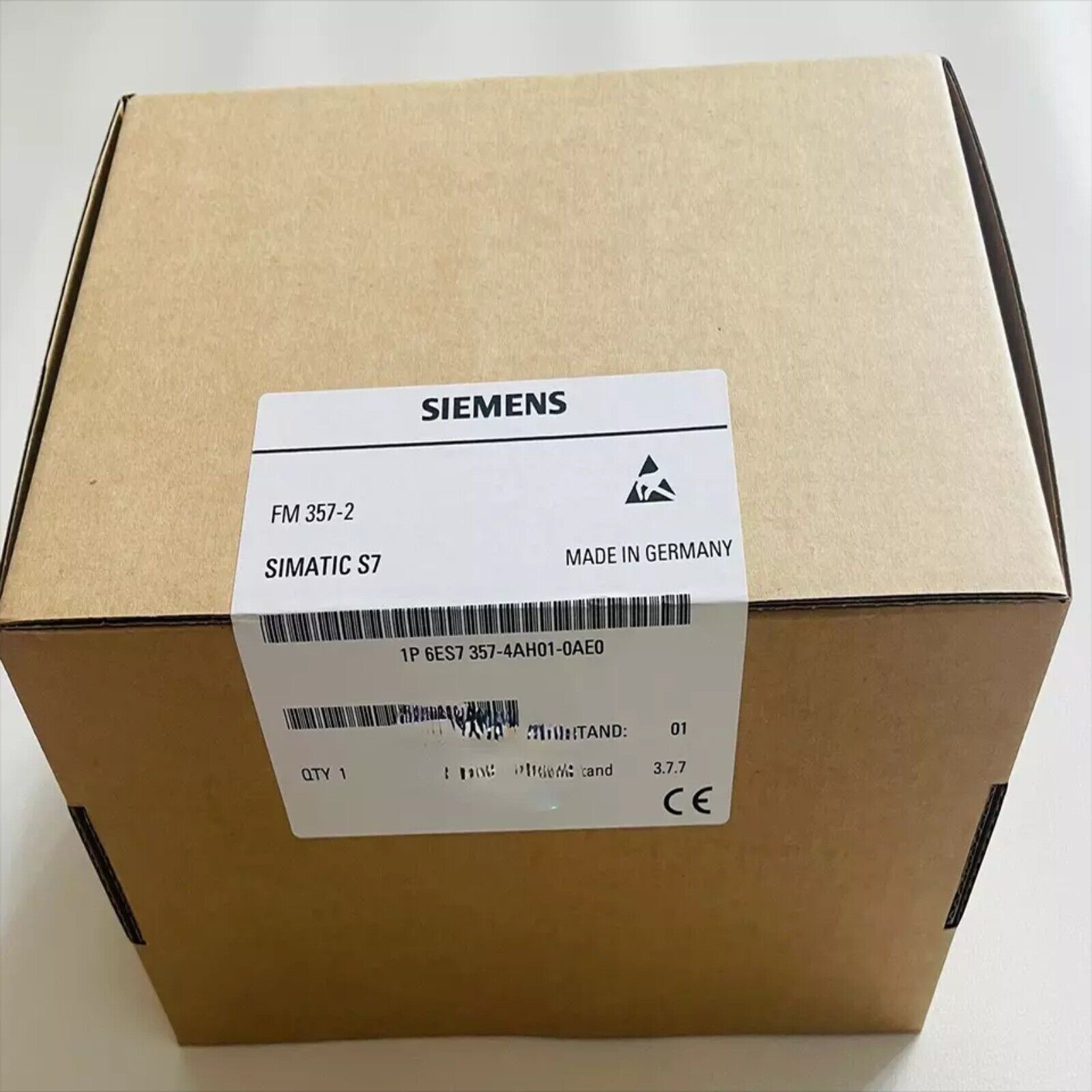 Siemens SIMATIC S7-300 FM 357-2 function module in a brown cardboard box, industrial automation part